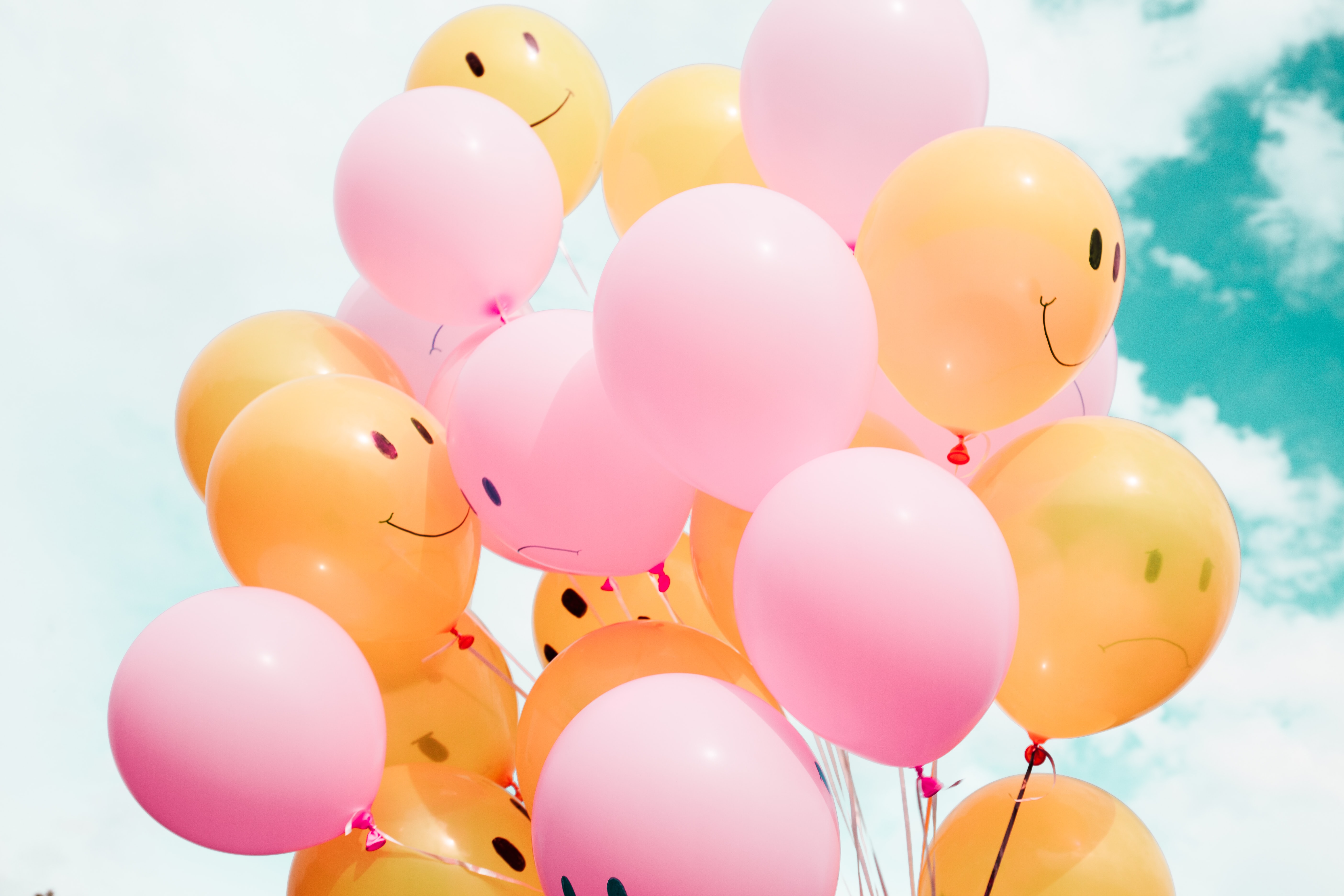 Some very happy looking balloons in front of a cloud. Kind of the way I'm happy in the cloud.